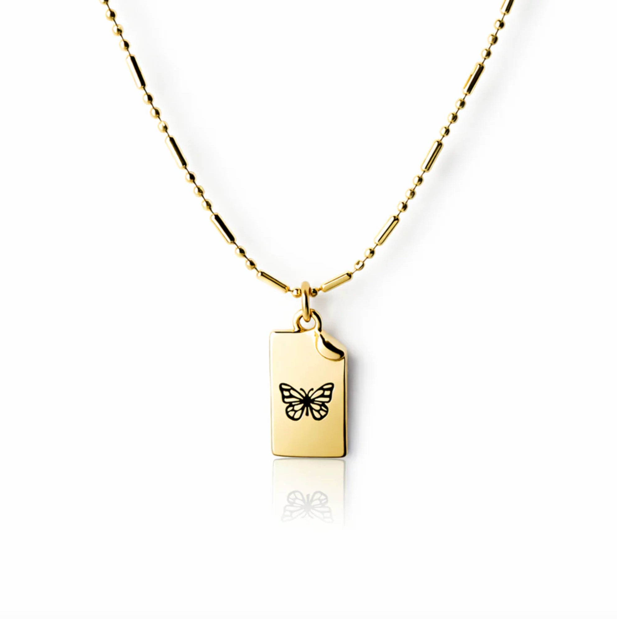 Gold necklace with a butterfly pendant on a white background