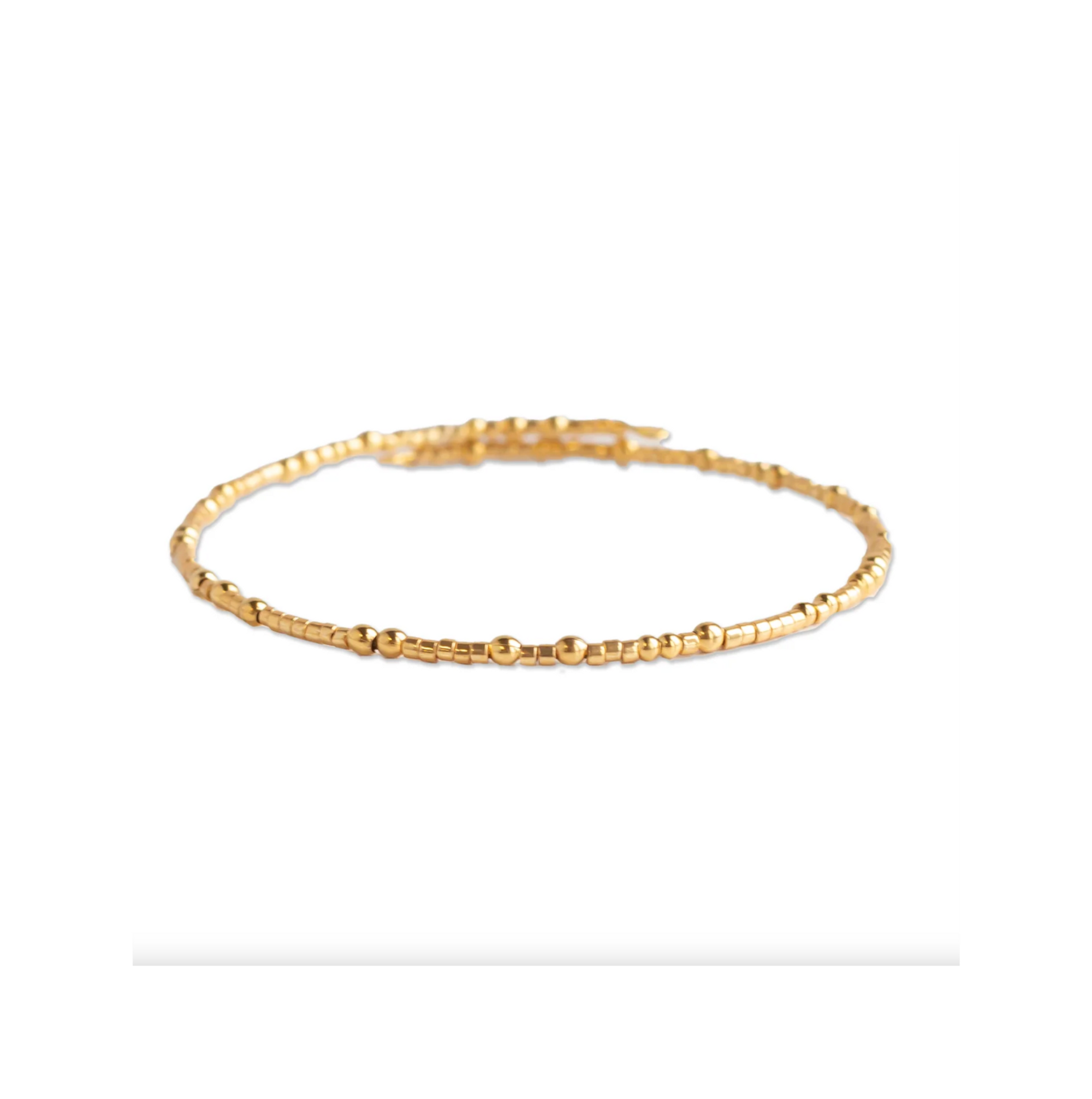 Gold bracelet on a white background